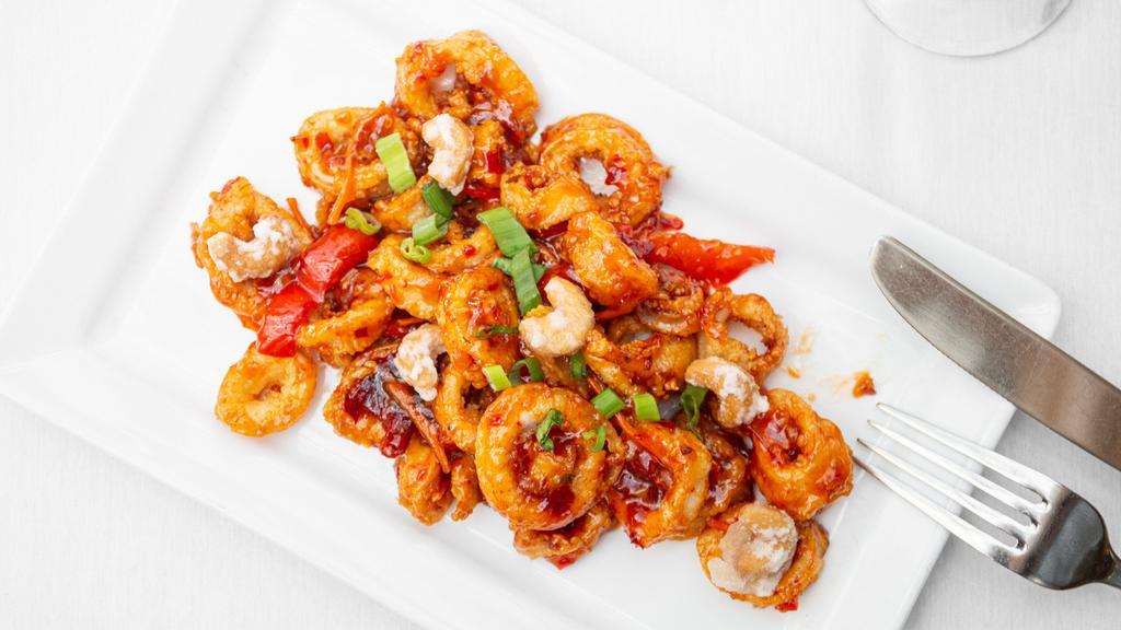 Sweet & Spicy Calamari · Chili peppers, scallions, julienned carrots in a sweet and spicy chili sauce, sprinkled with candied cashews.