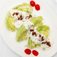The Wedge · Wedges of iceberg lettuce with Maytag bleu cheese dressing and crispy smoked applewood bacon...