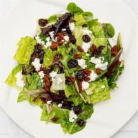 House Salad · Fresh spinach, frisée and baby greens tossed with goat cheese, toasted spiced pecans and dri...