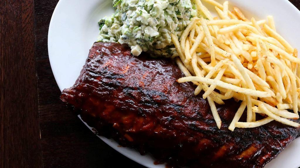 Danish Barbeque Pork Ribs · Slow-cooked and fall-off-the-bone tender, with french fries and coleslaw.
