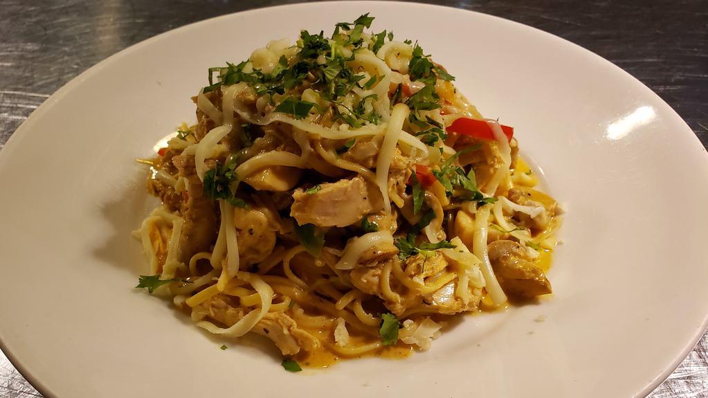 Rattlesnake Pasta · Fresh rotisserie chicken with garlic, tri bell peppers, mushrooms, and lime juice. Tossed with linguini pasta in a cajun alfredo sauce. Topped with smoked mozzarella cheese and chopped cilantro.