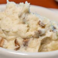 Mashed Potatoes · Idaho potatoes tossed with sour cream, butter, kosher salt, fresh-cracked black pepper, and ...