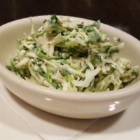 Coleslaw · Chopped cabbage, green onions, and parsley, tossed in a sweet, creamy blend of mayo, sugar, ...