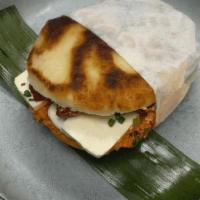 Tomate And Cheese (Vegetarian) · White corn cake stuffed with oven roasted tomato, brie, and queso fresco