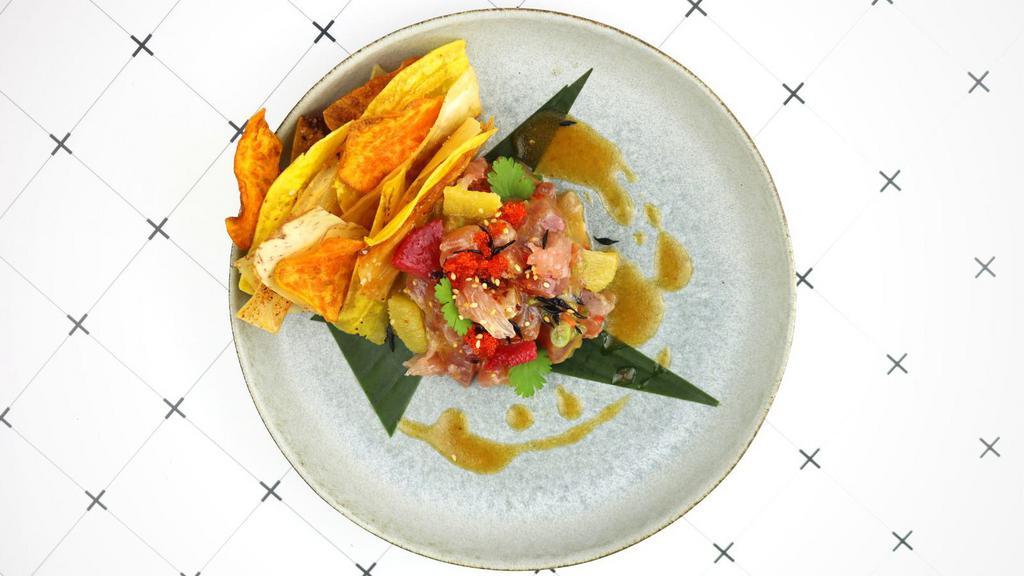 Spicy Tuna  · Yellowfin tuna, jalapeño, assorted citrus & spicy lemon dressing