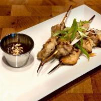 Chicken Grilled Skewers · 2 pieces of marinated chicken thigh grilled.