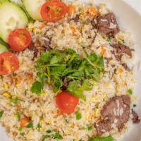 Fried Rice · Stir-fried jasmine rice with peas, carrots, and scallions. Topped with cilantro. Choice of v...