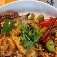 Kung Pao Chicken · Tender pieces of chicken thigh tossed in our house kung pao sauce, bell peppers, onions, and...