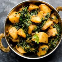 Saag Aloo · Potato cooked with spinach, mildly flavored with fresh herbs and spices.