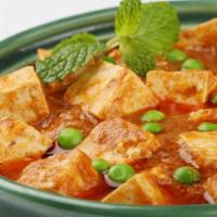 Paneer Masala · Chunks of cheese sautéed with onions, tomato, bell pepper, served in thick sauce.