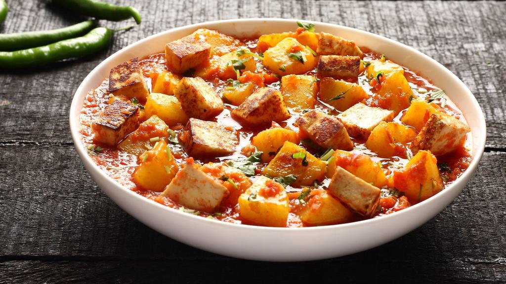 Aloo Paneer · Fresh cheese, potatoes and green pease curried and served in brown sauce.