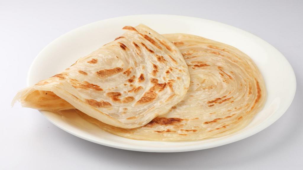 Paratha · Indian style multi-layered whole wheat bread topped with butter.