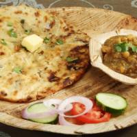 Aloo Kulcha · Paratha stuffed with mildly spiced mashed potatoes & peas.