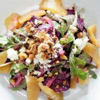 Beet Salad · Roasted red and golden beets, pickled red onion, arugula, mild goat cheese, toasted hazelnut...