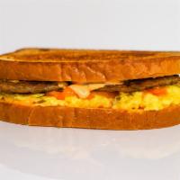 Sourdough, Sausage, Egg, & Cheddar Sandwich · 3 scrambled eggs, melted Cheddar cheese, breakfast sausage, and Sriracha aioli on grilled so...
