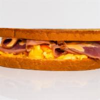 Sourdough, Ham, Egg, & Cheddar Sandwich · 3 scrambled eggs, melted Cheddar cheese, sliced ham, and Sriracha aioli on grilled sourdough.