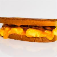 Sourdough, Bacon, Egg, & Cheddar Sandwich · 3 scrambled eggs, melted Cheddar cheese, smoked bacon, and Sriracha aioli on grilled sourdou...