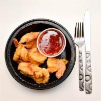 Hot Steppa Shrimp · Six plump, tail on jumbo shrimp, hand breaded then fried until golden and served with house ...