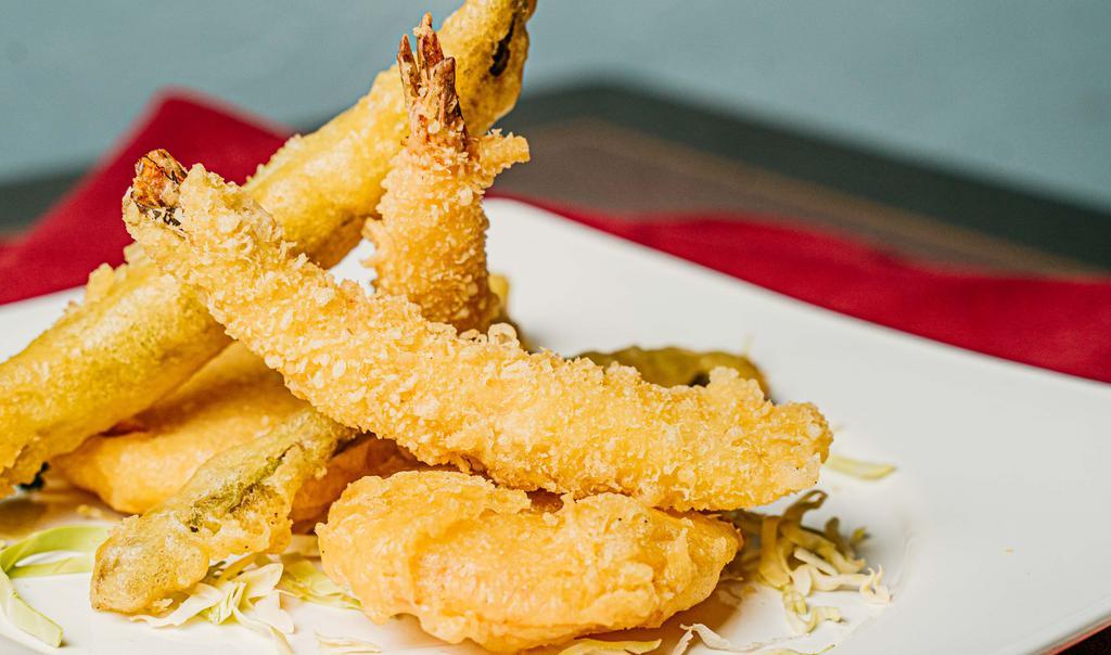 Tempura Trio · Lightly fried jumbo shrimps and assorted vegetables with tempura sauce.