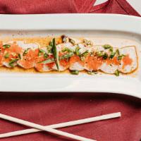 Hamachi Carpaccio · Thin sliced yellowtail sashimi with jalapeño, ponzu, and tobiko.