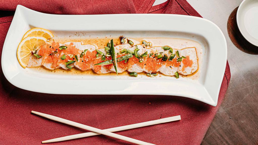 Hamachi Carpaccio · Thin sliced yellowtail sashimi with jalapeño, ponzu, and tobiko.