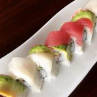 Rainbow Roll · Kani and cucumber inside topped with tuna, salmon, red snapper, cod, and avocado. Raw fish.