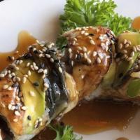 Dragon Roll · Spicy tuna inside topped with eel, avocado and eel sauce. Raw fish.