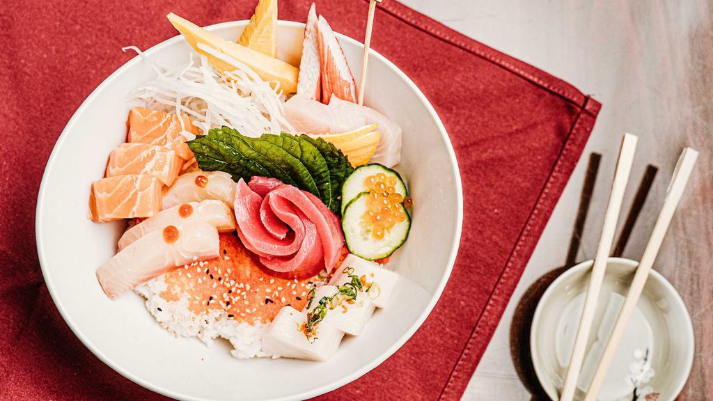 Chirashi · Sixteen pieces of sashimi with sushi rice. Served with miso soup and house salad.