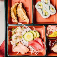 Salmon Teriyaki Bento · Served with either tempura trio, five pieces sushi or seven pieces of sashimi. Served with m...