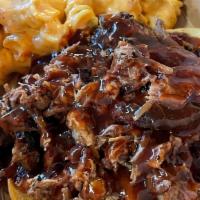 Pulled Pork Platter · House smoked pork shoulder hand pulled, sauced, and served with 2 sides.