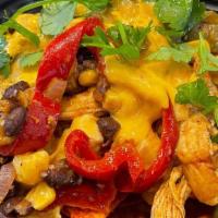 Soul Smoked Nachos · Chef's nachos of the day started with a base of tortilla chips layered with a combination of...