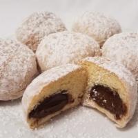 Trio Beignet · 3 small beignets (one filled with Dark choco, one with hazelnut choco and one with White cho...
