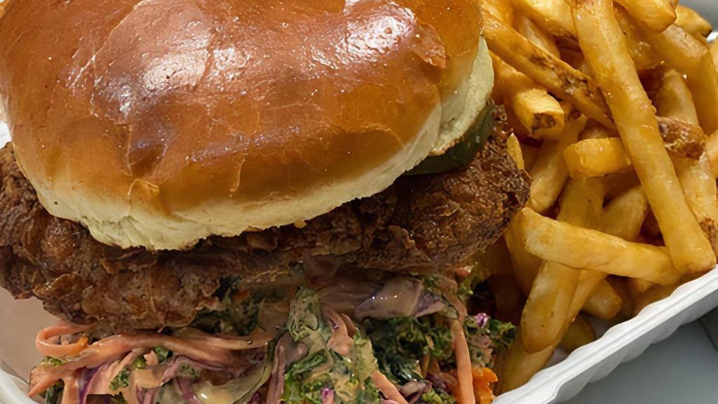Halang Chicken Sandwich · Pickled brined chicken thigh, brioche bun, house pickles, sweet and spicy kale slaw, sili mayo. Served with fries