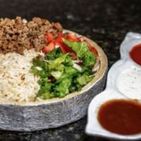 Gyro Over Rice Platter  · Served with gyro, rice, lettuce, and tomatoes along with your favorite toppings and white an...