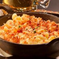 Taki Mac & Cheese · A blend of tillamook, asiago, pinconning & bellavitano cheese baked with takis crumbs.