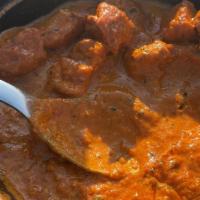 Chicken Tikka Masala · Chicken breast tenders marinated in spices and yogurt, baked in a tandoor oven and cooked in...