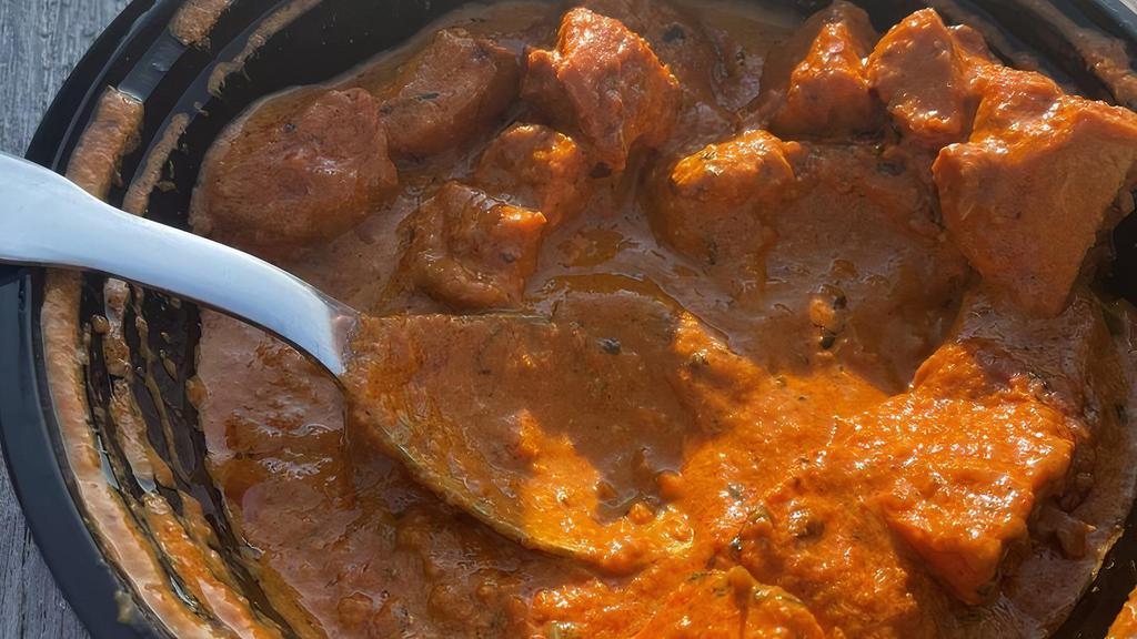 Chicken Tikka Masala · Chicken breast tenders marinated in spices and yogurt, baked in a tandoor oven and cooked in a tomato based creamy sauce.