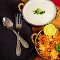 Vegetable Biryani · Basmati rice flavored with spices and saffron, cooked with stir fried carrots, peas, and cau...