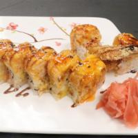 Cumberland Roll · Hot and spicy. Shrimp tempura and mango inside. Topped with spicy crab meat and shrimp chef'...