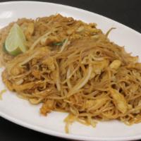 Pad Thai · Hot and spicy. With bean sprout, scallions, cabbage, egg, fresh lime, and ground peanuts.