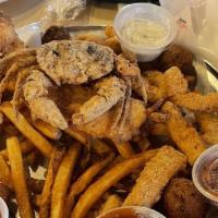 Big Sampler · Catfish, shrimp, calamari, soft crab, hush puppies, and Cajun fries.