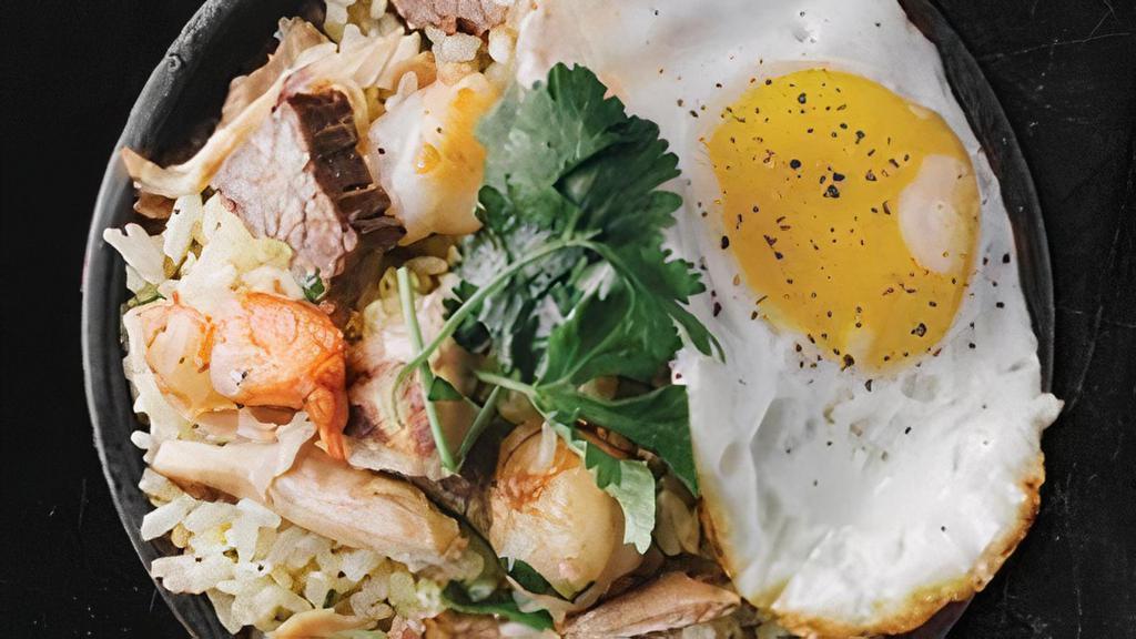 Triple X Fried Rice~ · Steak, shrimp, chicken, scrambled egg, flavored with Me’s (Mom’s) secret blend of spices and wok-tossed to perfection. Each order is topped with a runny egg.. * Consuming raw or undercooked eggs may increase your risk of foodborne illness.