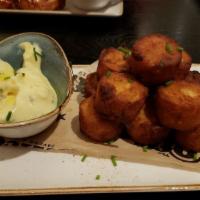 Truffled Tots · Housemade with truffle infused aioli, chives.