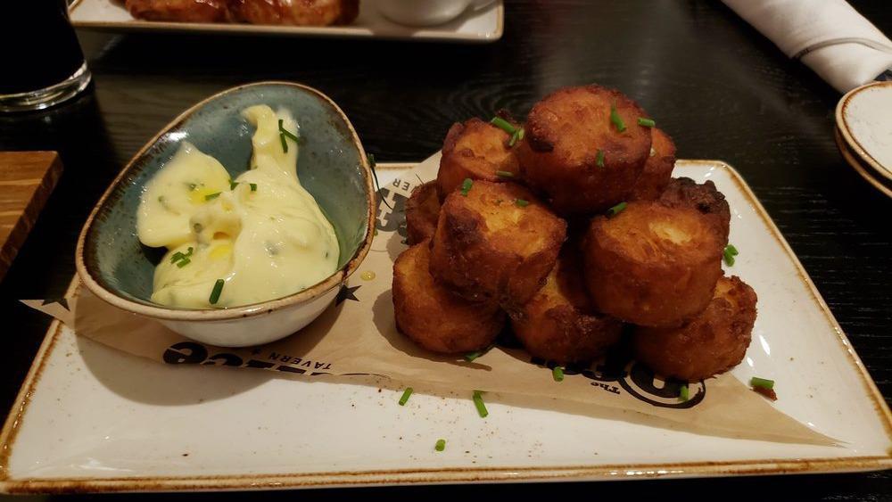 Truffled Tots · Housemade with truffle infused aioli, chives.