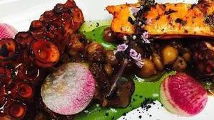 Grilled Octopus · Served with Chickpeas, Quinoa,and Roasted Peppers