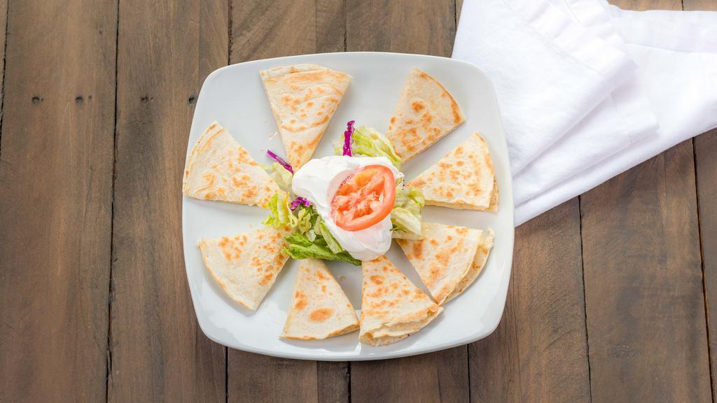 Cheese Quesadilla · Grilled flour tortillas stuffed with cheese, garnished with lettuce, tomato and sour cream.