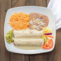 Burritos · Two flour tortillas stuffed with your choice of seasoned ground beef or shredded chicken, to...