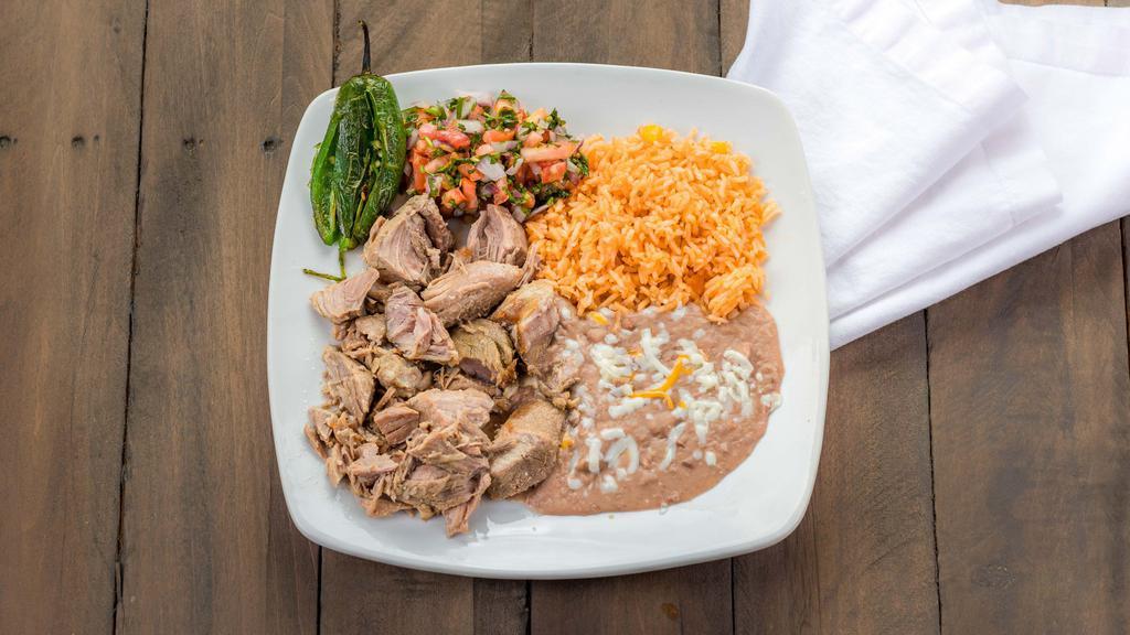 Carnitas · Chunks of pork grilled or fried, served with garnish lettuce, one jalapeño grilled, pico de gallo, corn or flour tortillas, rice and beans.