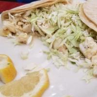 Fish Tacos · Three soft flour tortillas filled with grilled or fried tilapia, lettuce, tomato and avocado...