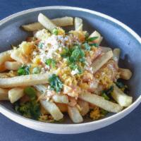 Loaded Fries · Time to indulge. A pile of fries topped with our hatch green chile queso, Tillamook cheddar,...